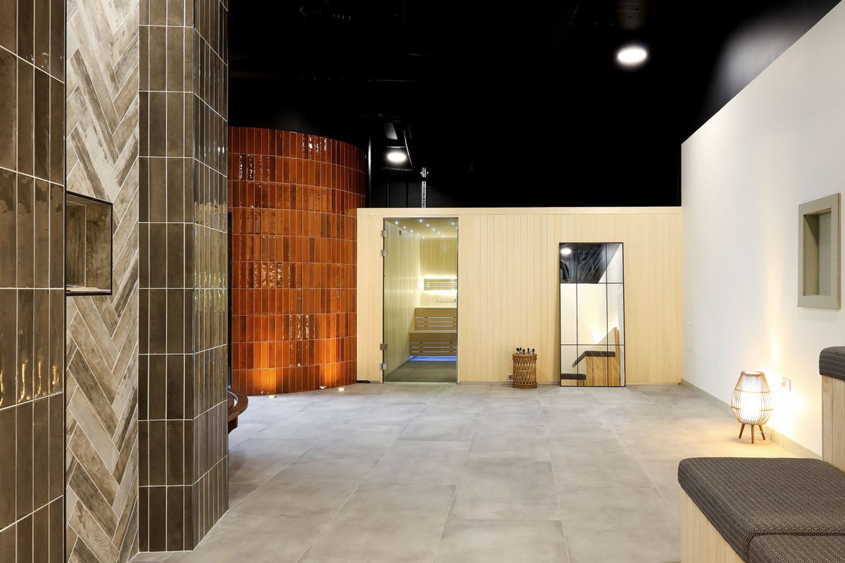 Lounge area with tiled columns and ambient lighting